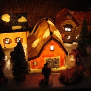 This is a pre-owned Winter Valley Cottages 15 piece porcelain lighted house set.